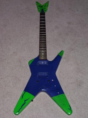 Old Dean model guitar that I stripped down and repainted.  I'm currently saving for some EMG pickups and some new tuning pegs (plus new pots, switches, etc) to get this bad boy in playing shape.  Interesting paint job, huh?