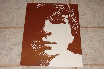 Portrait of my boyfriend. Done by cutting out the positive space in his face.