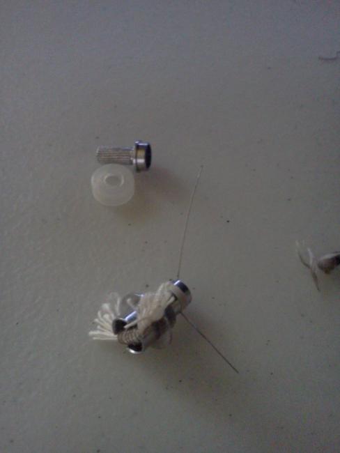 Rewiring and wicking.. I used one toothpick, snips and wrapped the wire 6 times around.. used an old threader for sewing and pulled the butcher's twine thru the coil.. I left it a bit long..