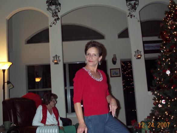 Sis - trying to keep her composure in the midst of my sexist jokes out at their place the day before Christmas-07 -- all I said was... .... ahh nevermind.