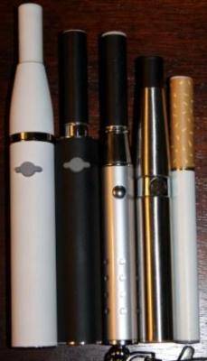 Size comparison.  My friend Jai's Hello 016's, Laser Mod (sold), stainless steel eGo (mine mine mine) and a standard 510 auto battery.  All have 510 cartomizers on them with the exception of the white Hello, which has cone/atty on it.