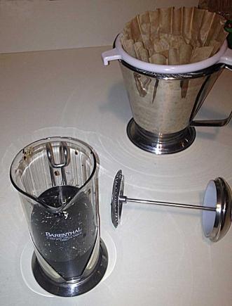 The Coffee Press loaded up, and the paper coffee filter in place in a strainer to do the second straining of the juice.