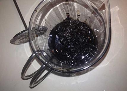 The first batch of NET sludge to get filtered--a Santa Damiana Robusto, loaded into the coffee press for initial straining.