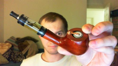 The Jazz cartopipe (Romaniac) with the MAP Tank mod (CloudsOfVapor.com) filled with Torque 56 (HaloCigs.com) and extended with a 510 extension (MadVapes.com), a shorty 510 Delrin plastic drip tip (ElectroNicStix.com), and a Protected Ultrafire 16340/CR123a battery (MadVapes.com).
