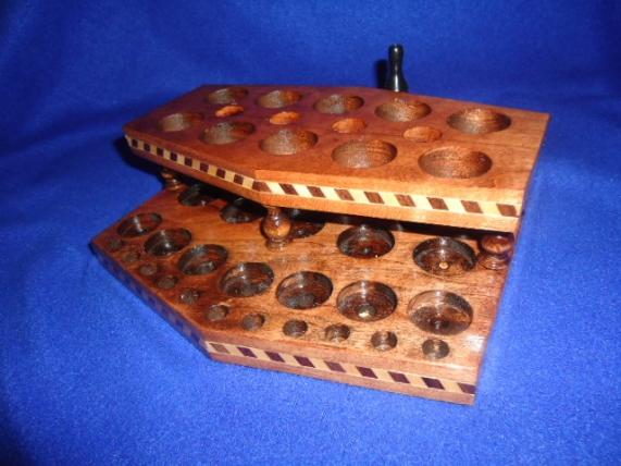 This side holds seven tanks, or bottles of juice and 11 drip tips. Got this custom made by Wayne Church at http://www.customwoodpvecigholders.com/. Awesome craftsmanship and less than a Franklin.