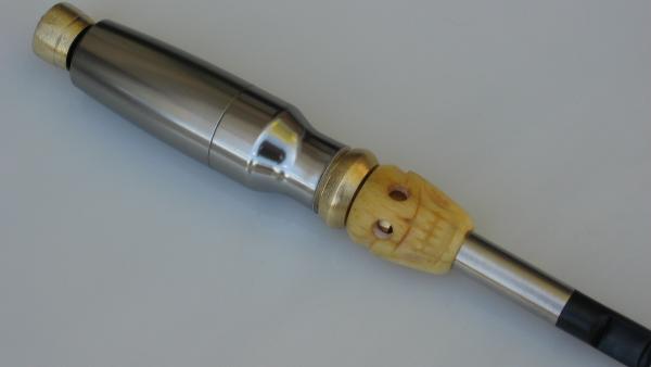 torch mod, works like a champ although I found having the button on the bottom makes for a sore pinky, uses a tire valve connector fit inside a brass fitting I poor man milled to be press(hammered) into the body.  Skull is cow (I hope)
bone, bought from a swapmeet in phoenix back in the early 80's....ahhh, good times, good times.....