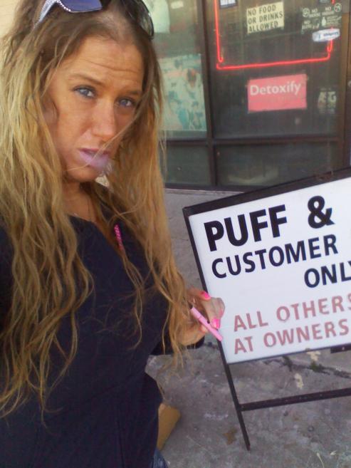 Vape in front of a smoke shop