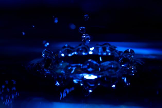 Water drop, splash in blue