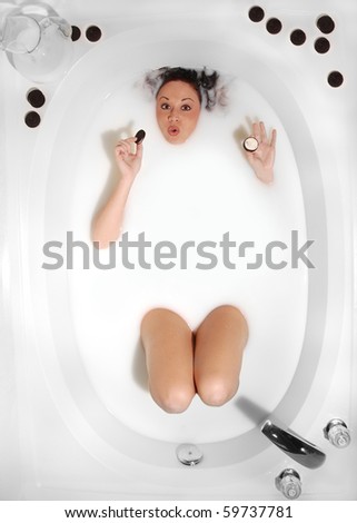 stock-photo-woman-taking-a-milk-bath-eating-cookies-59737781.jpg