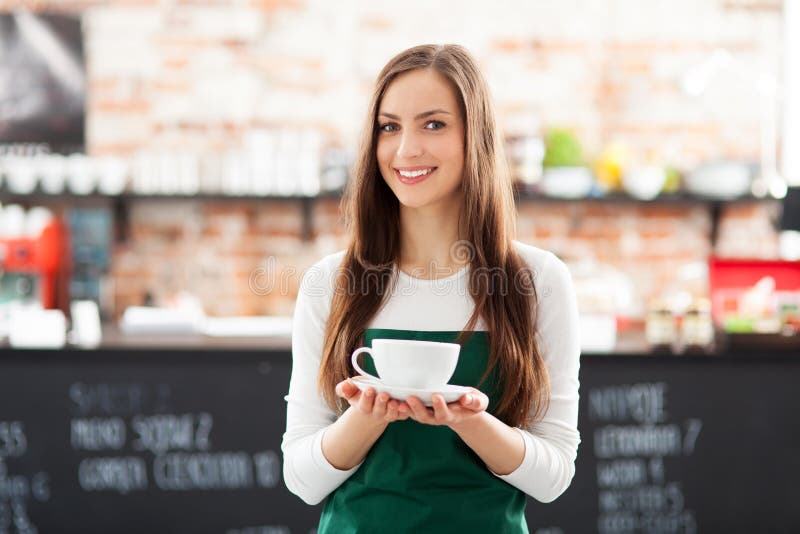 waitress-holding-cup-coffee-cafe-29912838.jpg