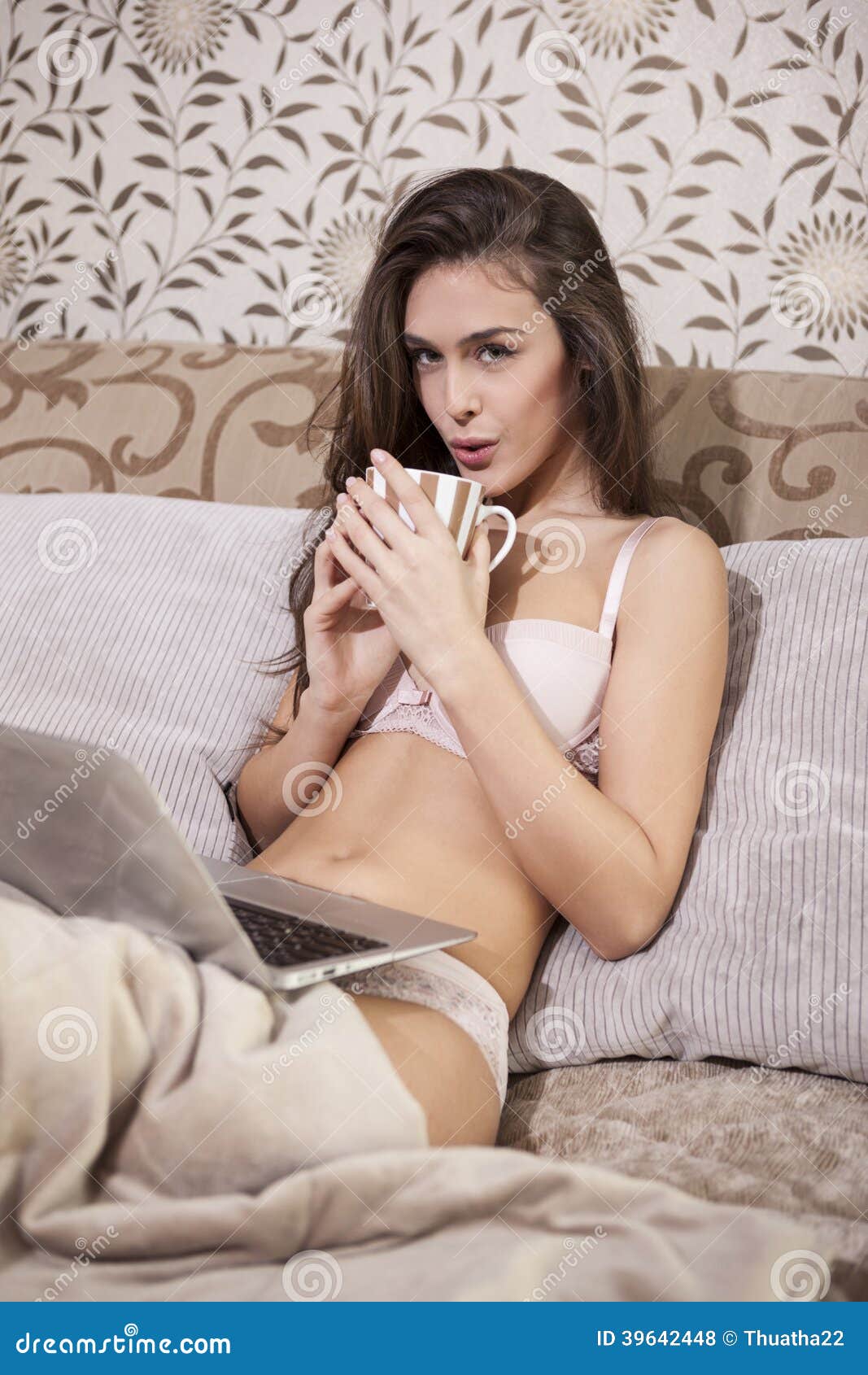 sexy-girl-drinking-coffee-bed-39642448.jpg