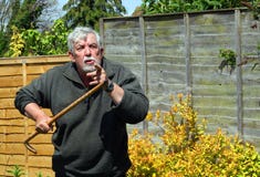 angry-man-walking-stick-senior-pointing-camera-43072479.jpg