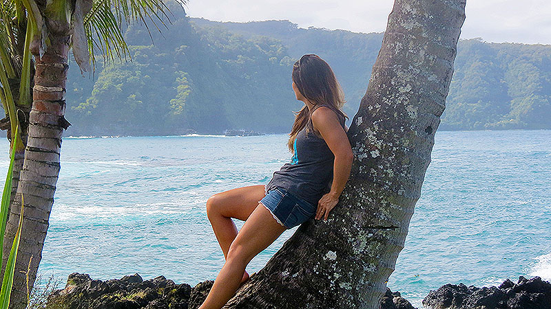 nell-leaning-on-palm-tree.jpg