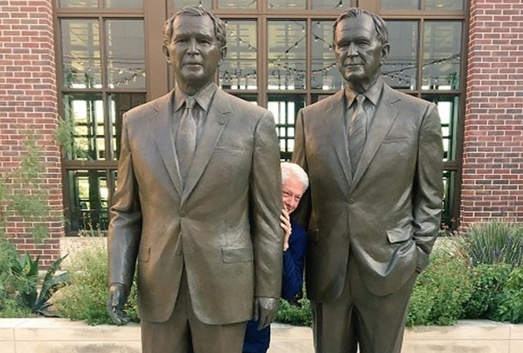 clinton-amid-bush-statues.jpg