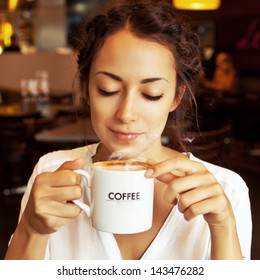 beautiful-woman-drinking-coffee-260nw-143476282.jpg
