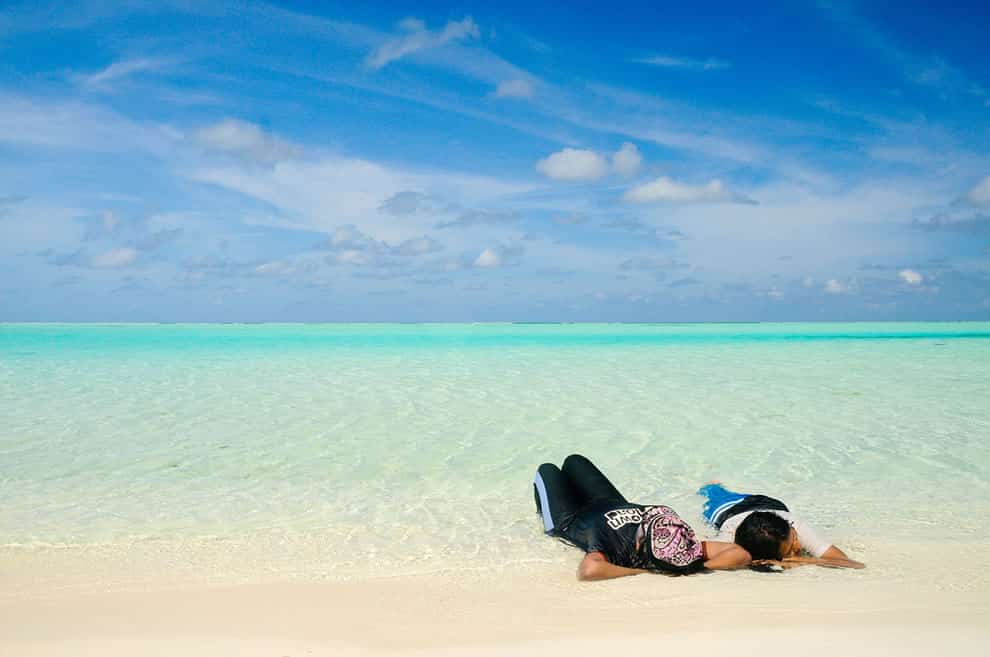 Kicking-back-in-white-sand-and-water-of-the-Maldives.jpg