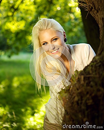 cute-female-hiding-behind-tree-21372076.jpg