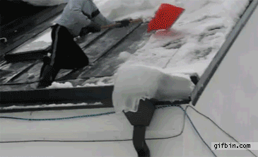 1295001293_snow-pushes-down-man-from-roof.gif