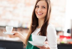 waitress-holding-cups-coffee-cafe-30081404.jpg