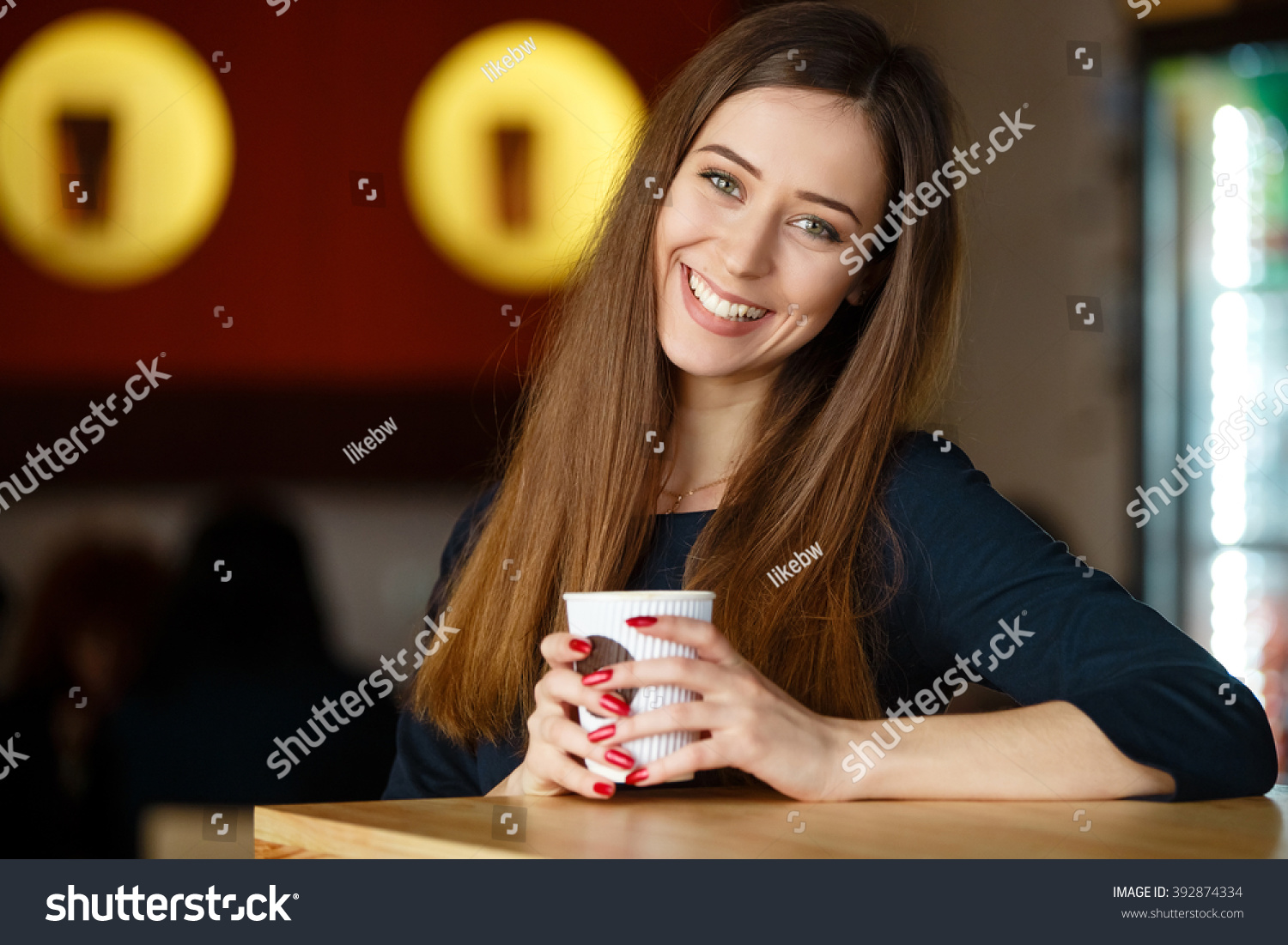 stock-photo-cute-girl-drinking-coffee-392874334.jpg