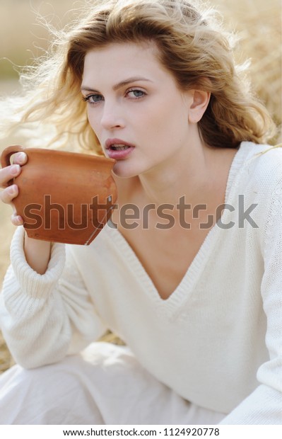 beautiful-young-woman-drinking-milk-600w-1124920778.jpg