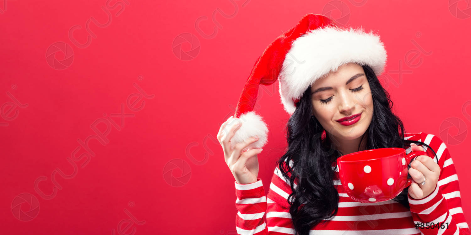 woman-with-santa-hat-drinking-850461.jpg