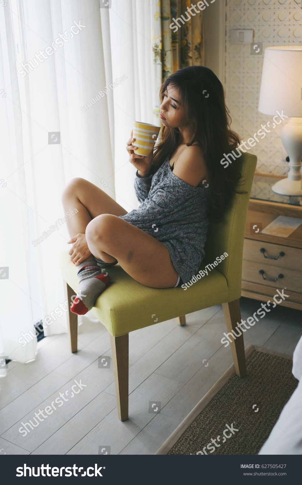 stock-photo-asian-sexy-girl-drink-coffee-in-bedroom-627505427.jpg