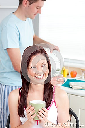 joyful-woman-drinking-coffee-and-smiling-at-home-thumb15875454.jpg