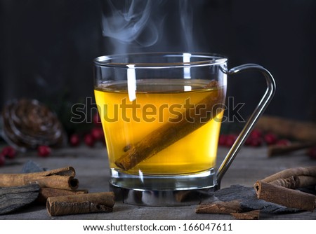 stock-photo-hot-whiskey-rum-apple-or-brandy-toddy-cocktail-drink-with-cinnamon-set-on-rustic-wood-166047611.jpg