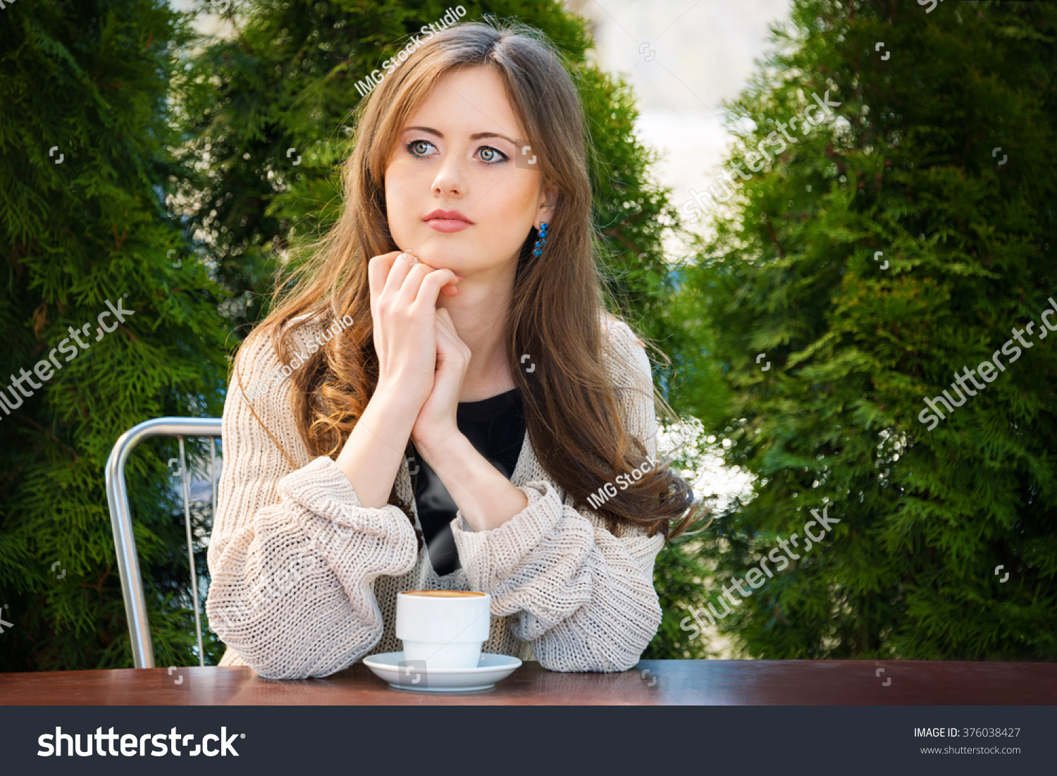 stock-photo-beautiful-young-woman-drinking-hot-coffee-in-the-morning-at-restaurant-lifestyle-photo-girl-376038427.jpg