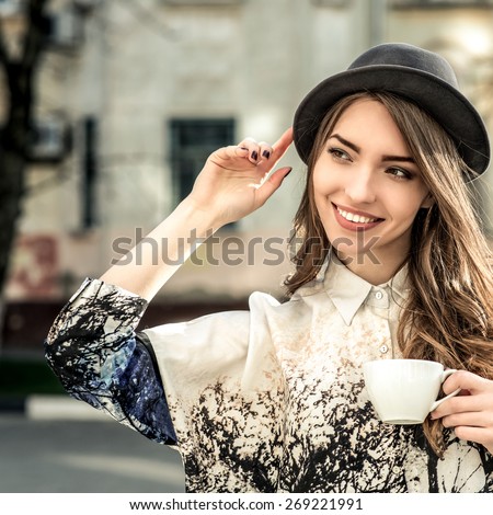 stock-photo-attractive-woman-poses-with-white-cup-happy-smile-girl-drink-smell-coffee-or-tea-hold-cup-over-269221991.jpg