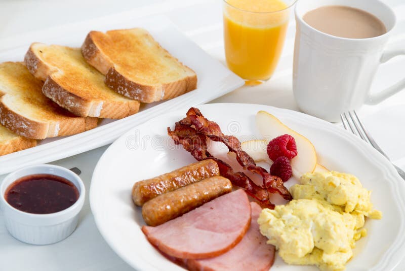 big-hearty-breakfast-delicious-traditional-american-bacon-sausage-ham-scrambled-eggs-all-trimmings-nice-67676743.jpg