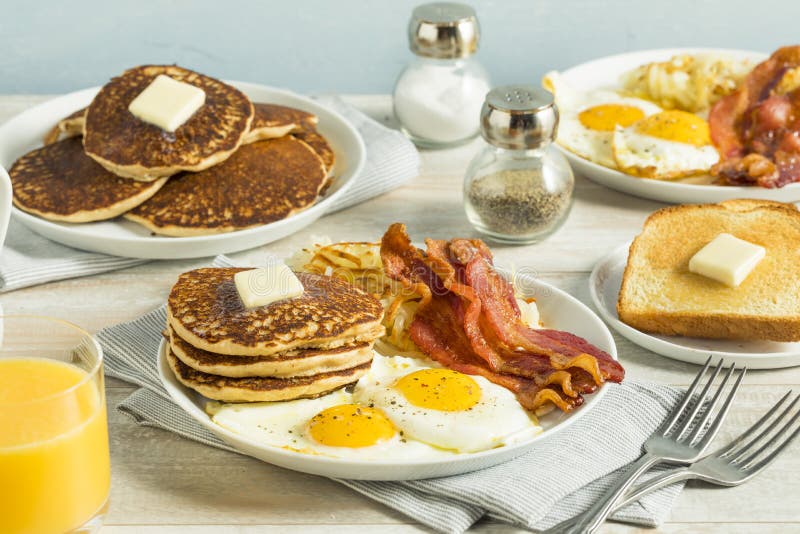 healthy-full-american-breakfast-eggs-bacon-pancakes-98646362.jpg