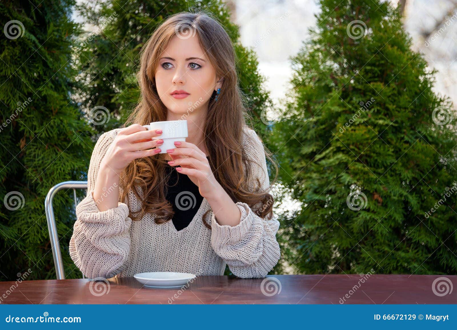 beautiful-young-woman-drinking-hot-coffee-tea-morning-restaurant-lifestyle-photo-girl-enjoying-her-morning-coffee-i-66672129.jpg