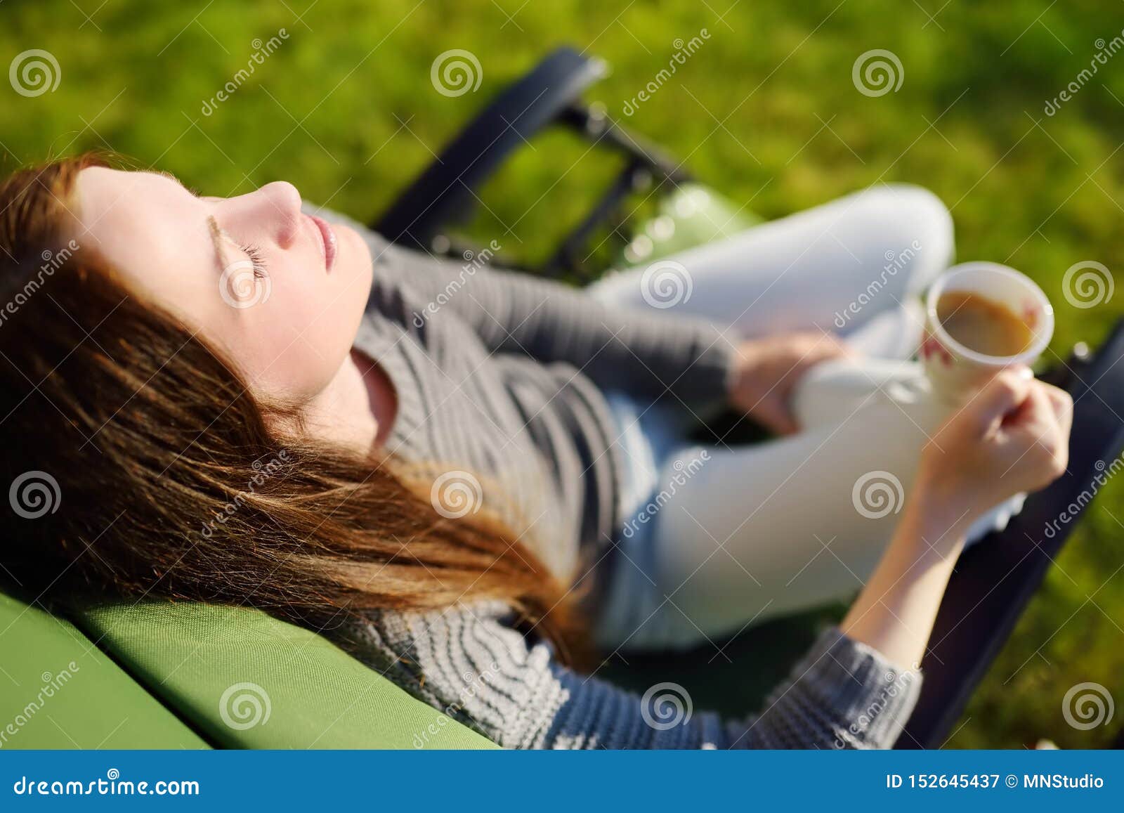 woman-relaxing-closed-eyes-cup-coffee-lounge-chair-sunny-day-outdoors-daydreaming-152645437.jpg