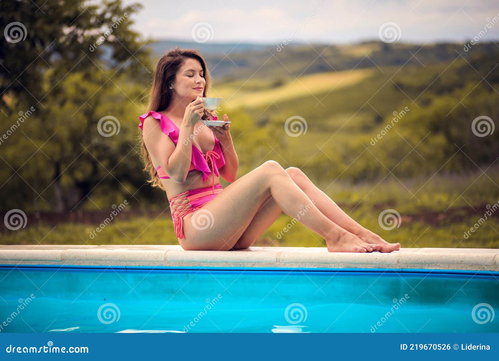 woman-sitting-pool-holding-cup-coffee-woman-sitting-pool-holding-cup-coffee-summer-219670526.jpg