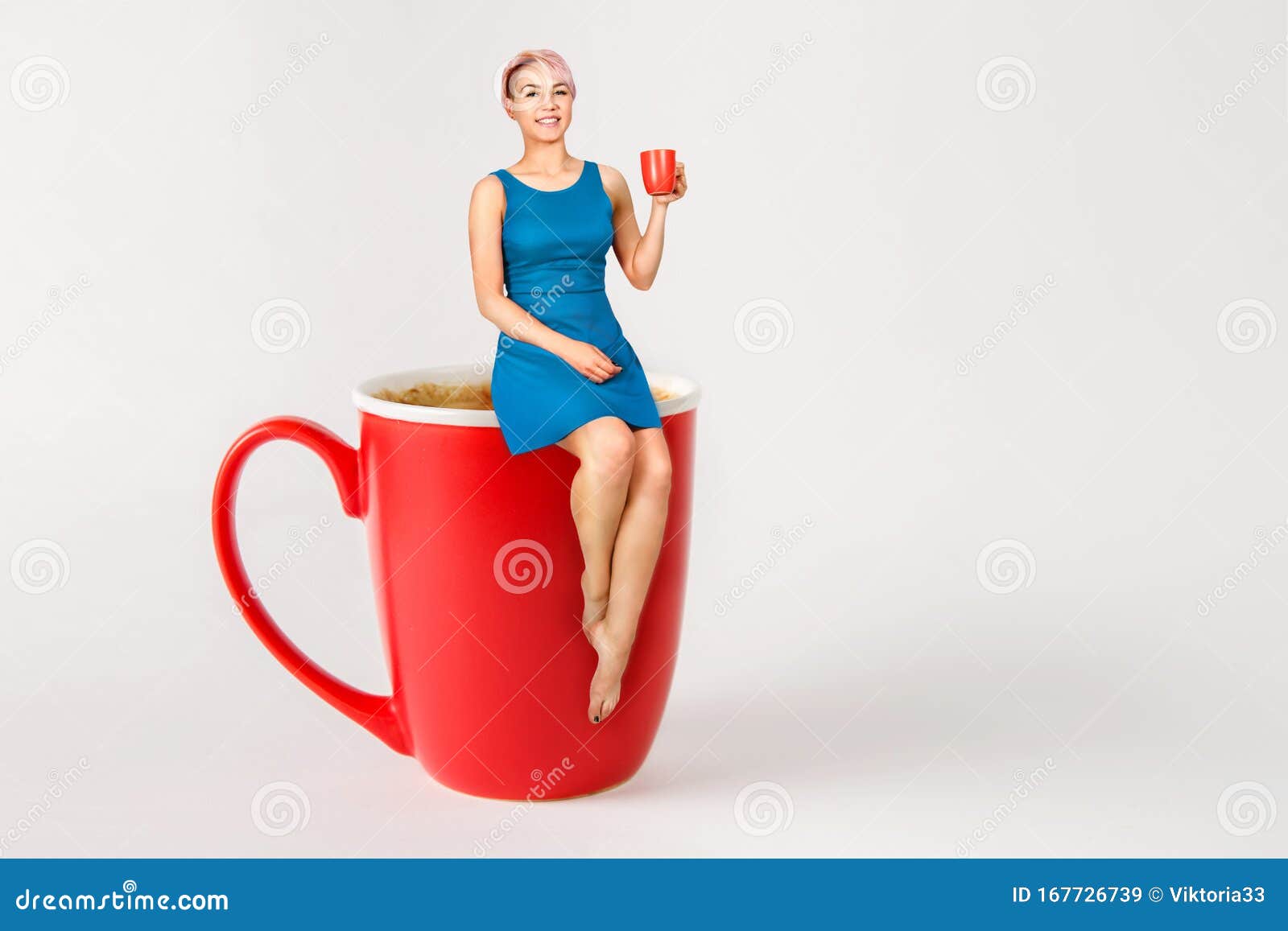 young-beautiful-girl-sits-big-cup-coffee-drinks-light-background-167726739.jpg