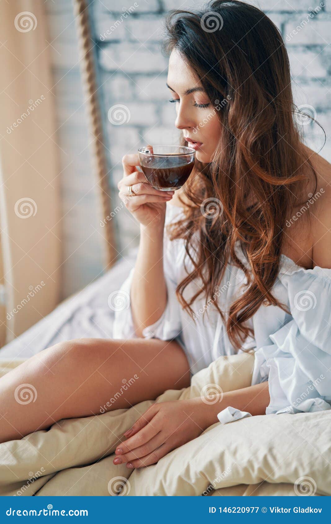 young-beautiful-woman-drinking-hot-coffee-sitting-bed-enjoying-her-good-morning-relax-carefrre-concept-young-beautiful-146220977.jpg