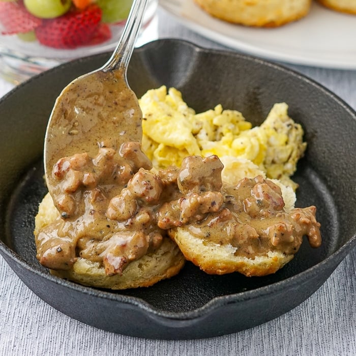 Southern-Sausage-Gravy-biscuts-and-scrambled-eggs-in-a-cast-iron-pan.jpg